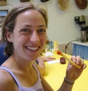 Emily savors a french fry.