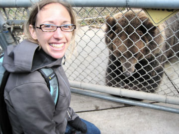 Science News for Kids reporter Emily Sohn gets up close and personal with a grizzly bear at the WSU Bear Center.