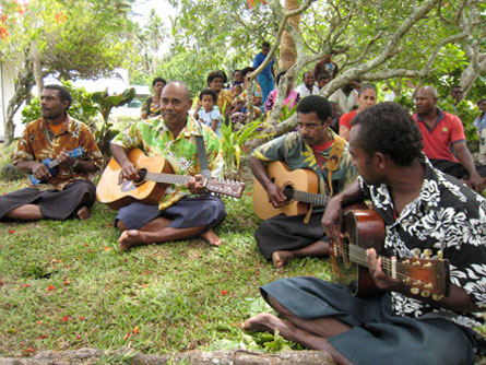 Floral shirts are common attire in the Kubalau, even among the high chiefs. The second man from the left, in the green shirt, is Tui Kubalau, the top chief of the district.