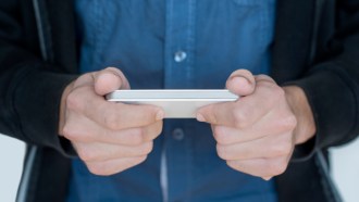 image of guy holding smartphone