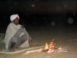 Warming up at a crackling fire.