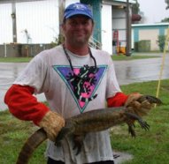 Todd Campbell holds a Nile monitor.