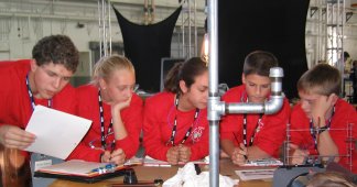 Zachary Hopkins, Samantha Bates, Elizabeth Monier, Ryan Lee, and Austin Minor (from left to right) of the red team discuss their plans for designing airfoils.