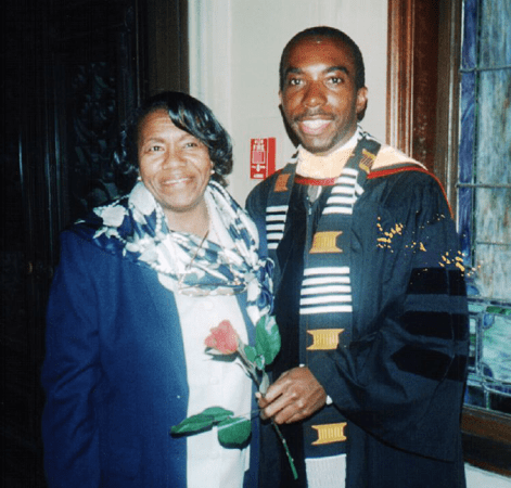 a photo from 1999 of Edray Goins and his mother celebrating graduating with his PhD in mathematics