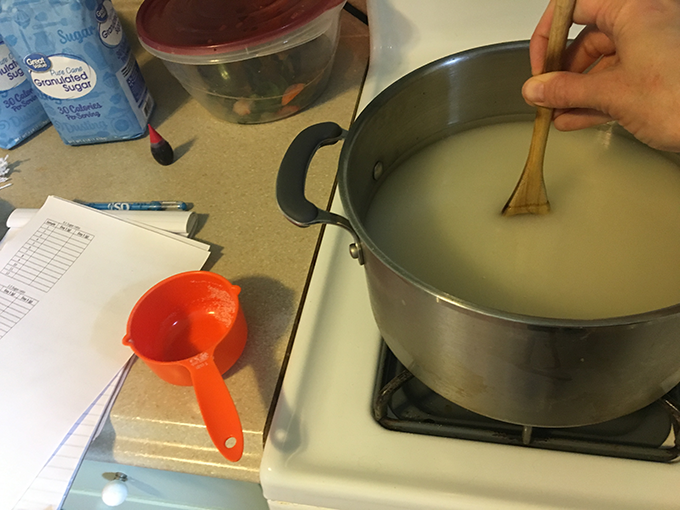 sugar solution being heated on the stovetop