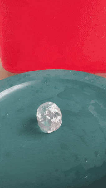 an animated image showing a tiny ice tower growing