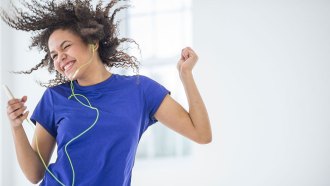 a photo of a girl dancing happily