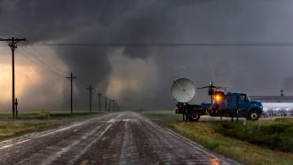 Scientists in a Doppler on Wheels radar truck scan a tornado near Dodge City, Kansas with doppler radar, May 24, 2016.