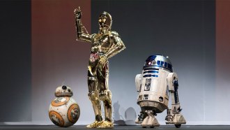 Three droids, BB-8, C-3PO and R2-D2 on a stage