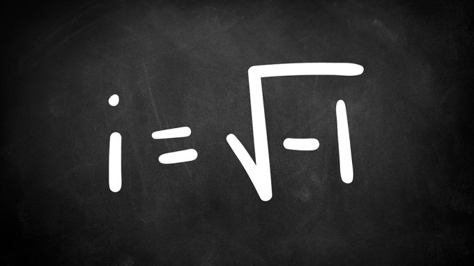 an equation written in chalk on a blackboard reads "i equals the square root of negative one"