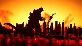 A silhouette of Godzilla stands over a ruined city. The background glows an ominous yellow and orange