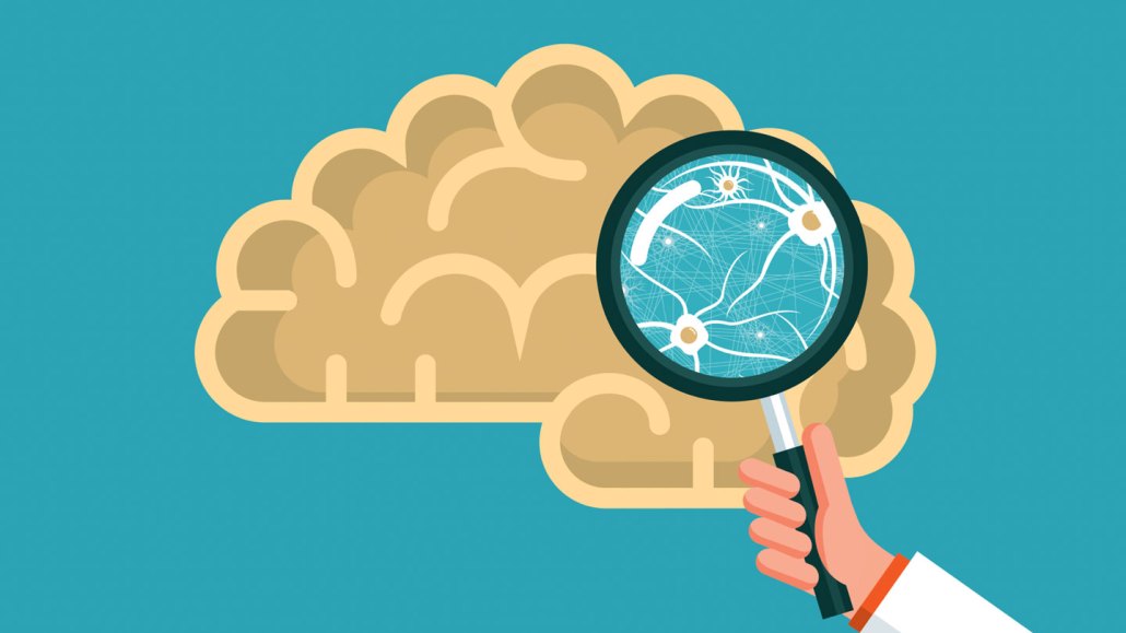 a cartoon illustration shows a brain against a blue background, with a hand holding a magnifying glass up to the brain to reveal the tiny connected neurons at work inside