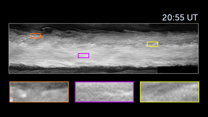 A close up of an area from the first false-color image of Jupiter. The image is seen in black and white with three bright features outlined in colored boxes seen 20:55 UT.