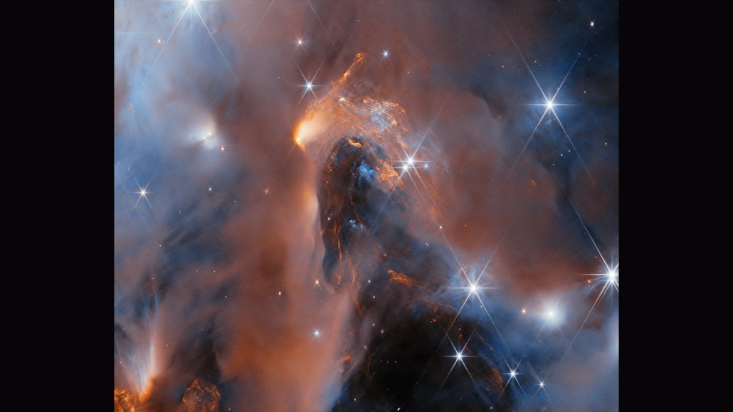 Gas and dust swirl, and stars twinkle, in an image of a stellar nursery. Some of the starlike objects captured in this image are baby planets, researchers say.