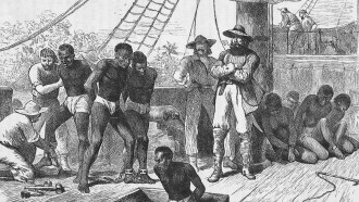 A wood engraving depicts several Black men on the deck of a ship, bound at the wrists and ankles, as several white men look on.