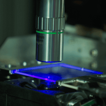 a microscope lens reading the lit up glass data sheet