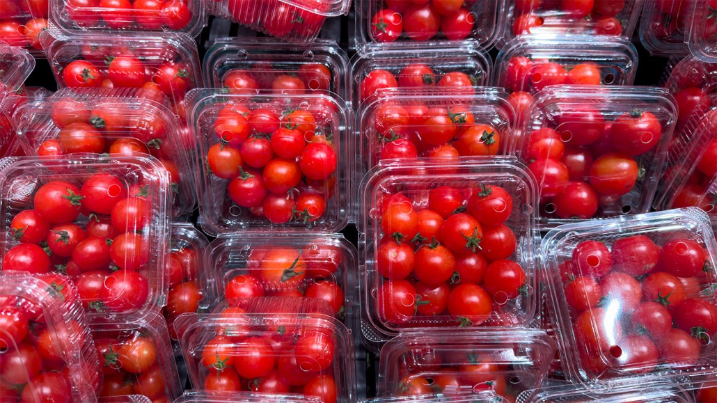 a photo of tomatoes in plastic clam shell packages