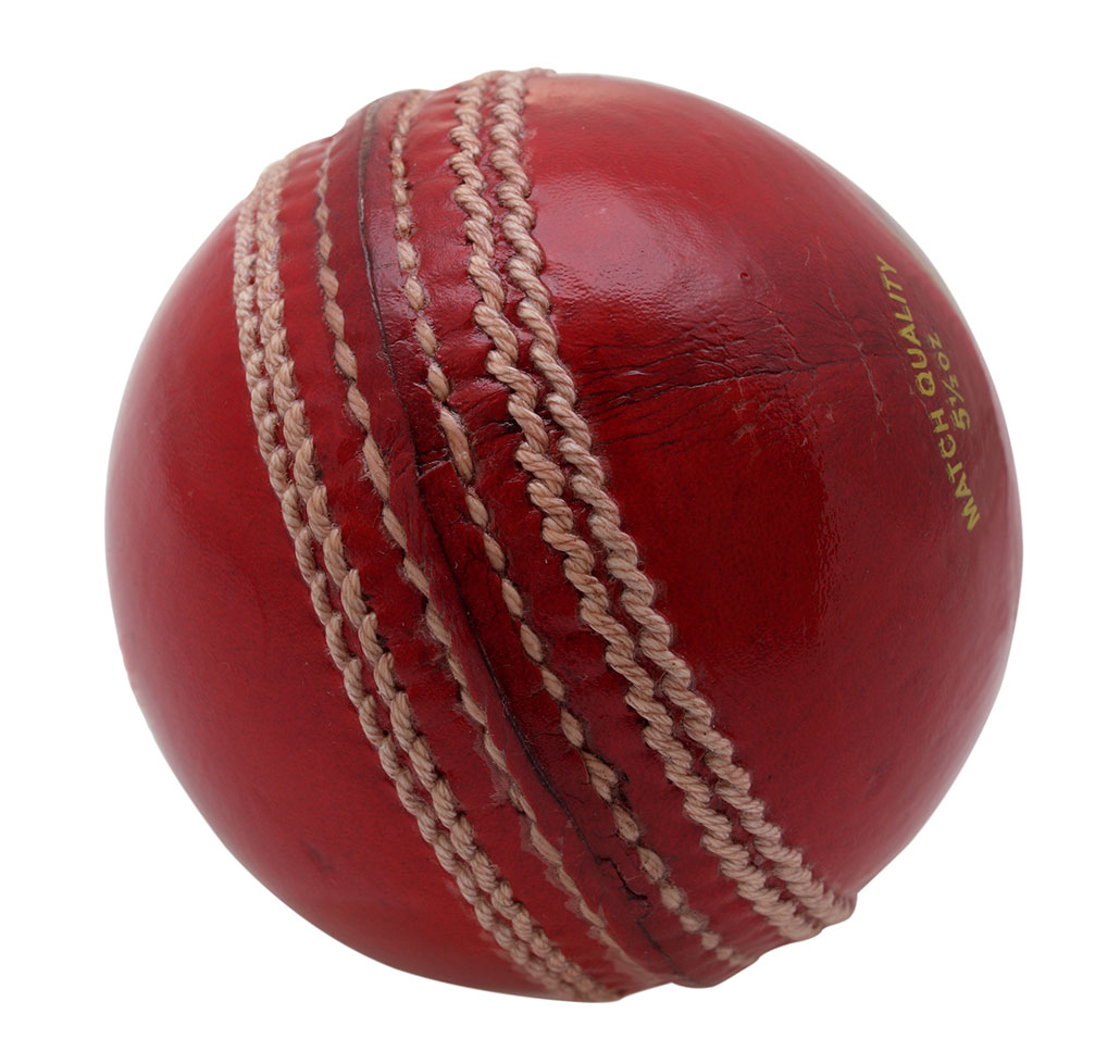 a red leather cricket ball with stitching in straight lines around the middle of the ball
