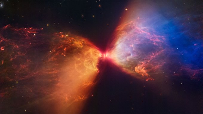 an image of L1527, a baby star, surrounded by dust and gas as seen with the James Webb Space Telescope