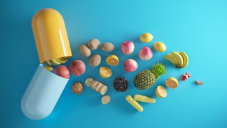 an illustration showing fruits, vegetables and other foods falling out of an open pill capsule meant to represent a vitamin supplement