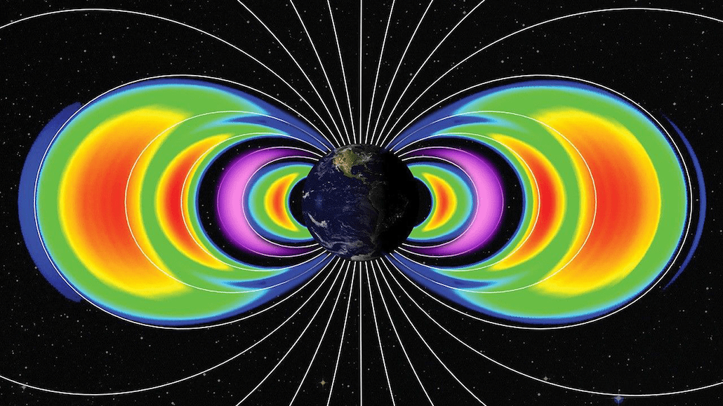 a set of crescent-shaped rings of different colors encircle earth