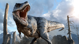 a tyrannosaurus rex opens its mouth on a roar as it prowls a barren landscape