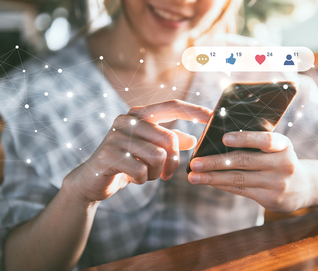 a person using a smart phone, with an illustration of social media comments, thumbs up, likes and new contact requests above the phone