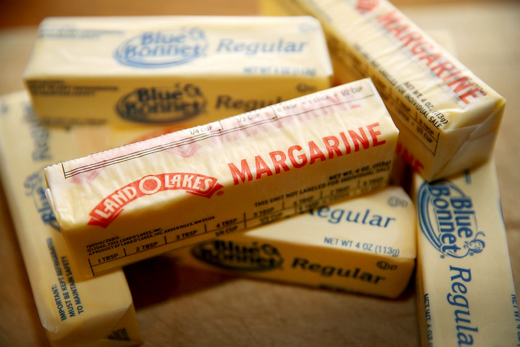a photo of a pile of wrapped sticks of margarine