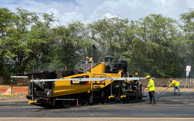 A road crew works on pavement in Hawaii
