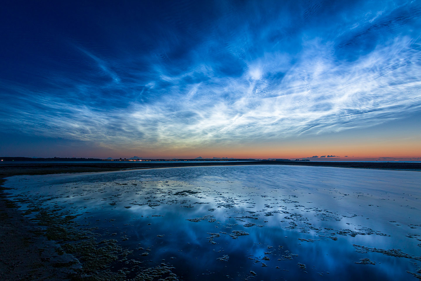 bright clouds above a dark seascape