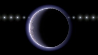 A distant icy world appears as a dark disk with a thin glowing halo of an atmosphere, with a line of repeated bright points showing a distant star at multiple positions.