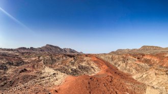 An image of he Turkana Rift Zone in Africa, where Earth’s crust is pulling apart. The landscape is mostly brown and barren.