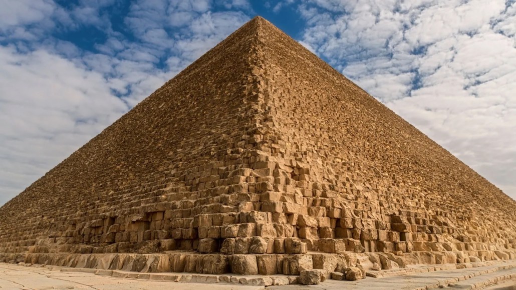 a picture of the Great Pyramid of Giza under a blue sky