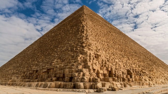 a picture of the Great Pyramid of Giza under a blue sky