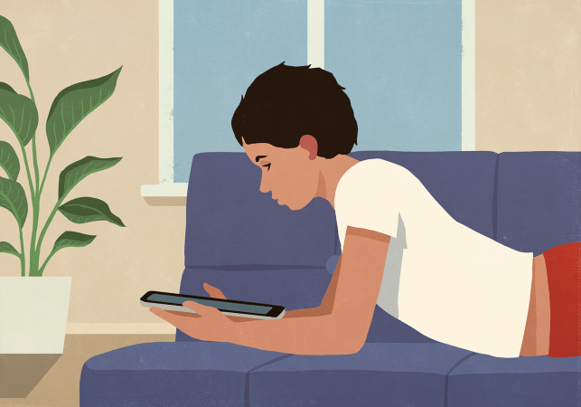 an illustration showing a boy laying on his stomach on a sofa and looking at a tablet