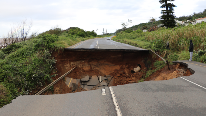 road splits in two, one part collapsed down