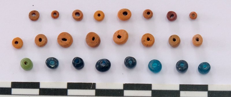 A close up of glass beads in various sizes and colors