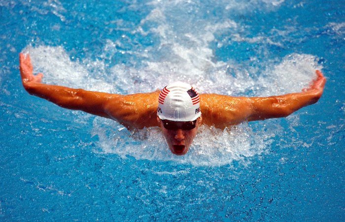a photo of Olympic athlete Michael Phelps swimming during a race