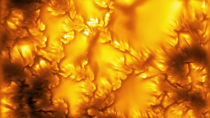 a detailed image of the sun's surface with jagged lines and shades of orange swirls of plasma