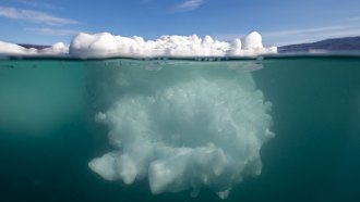 An iceberg as seen from above and below the water