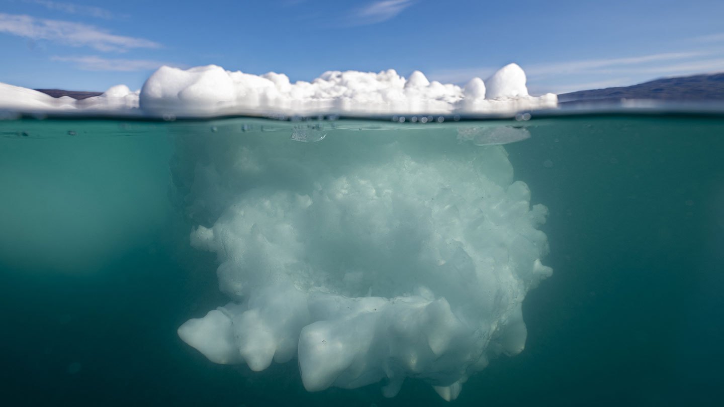 An iceberg as seen from above and below the water